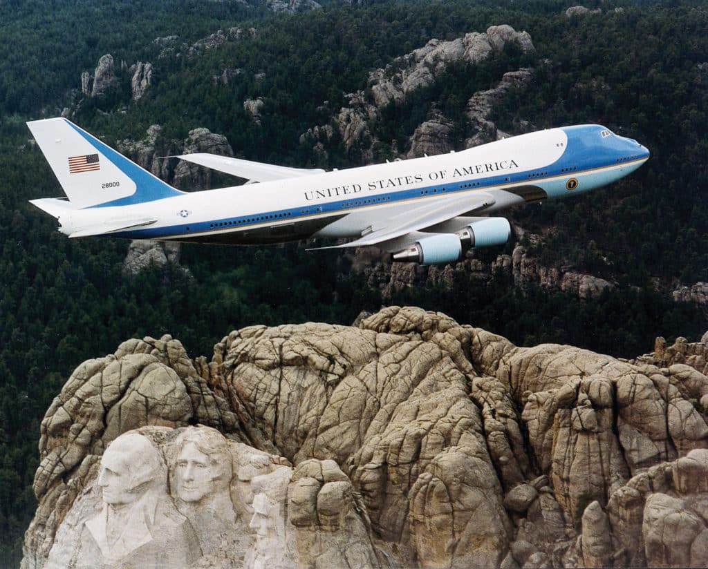 Air Force One flying over Mount Rushmore. Photo by United States Air Force. 2001