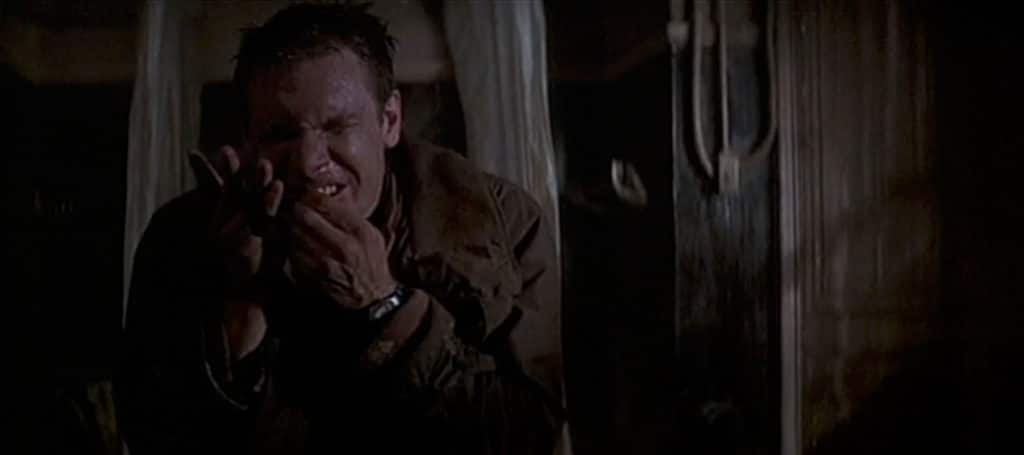 Deckard wrapping his broken fingers. His watch is clearly seen.