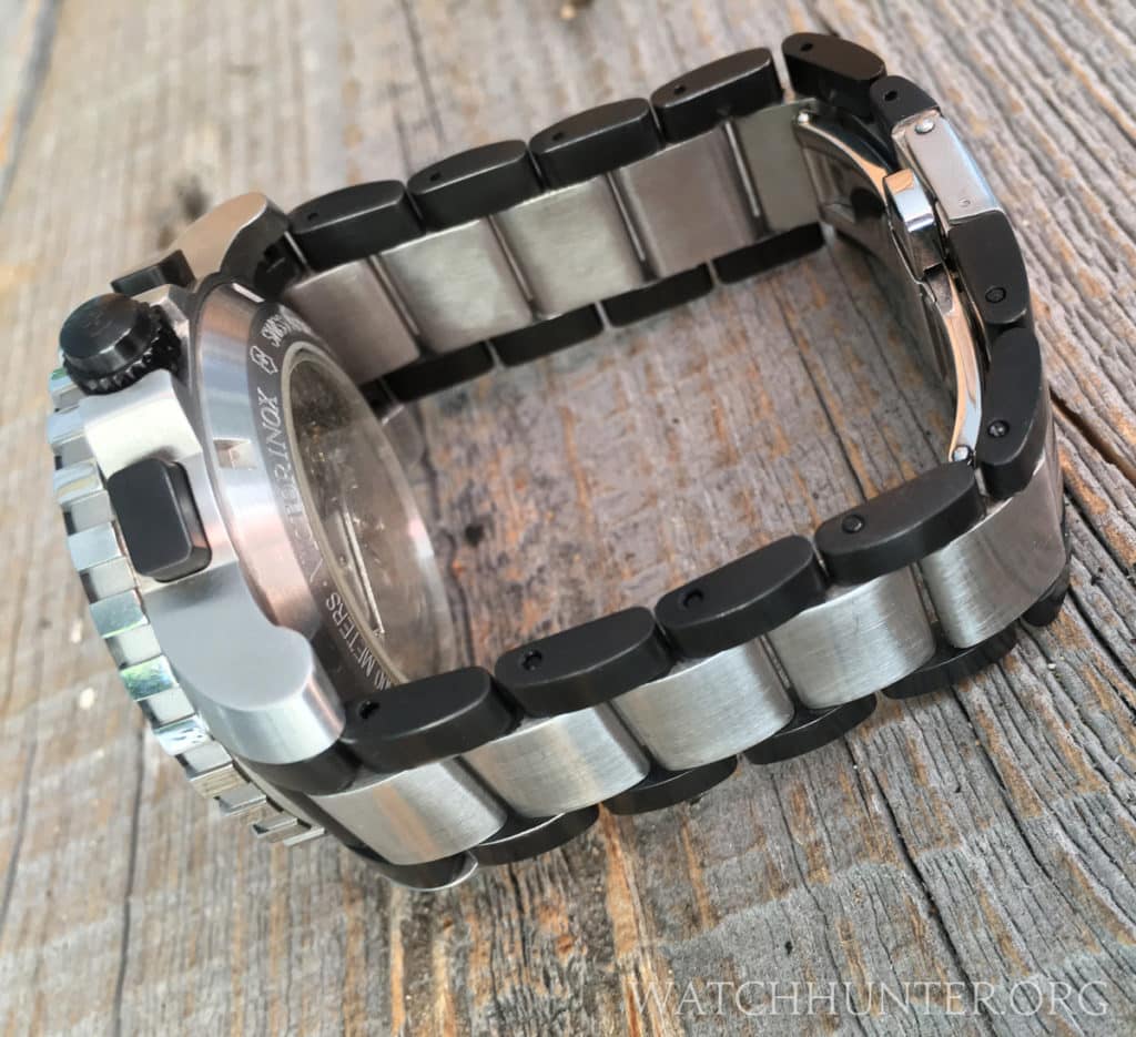 The distinctive two-tone black and silver bracelet